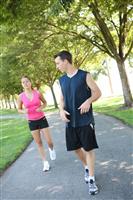 Attractive Man and Woman Couple Jogging stock photo