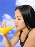 Woman Drinking OJ stock photo