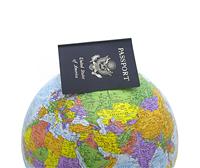 Passport on Globe stock photo