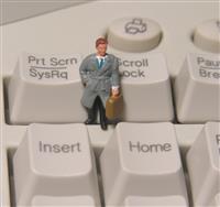 Businessman on Keyboard stock photo