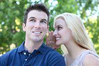 Attractive Couple Secret (Focus on Woman) stock photo