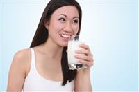 Asian Woman Drinking Milk stock photo