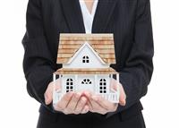 Woman Holding New Home stock photo