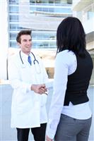 Doctor and Patient Handshake stock photo