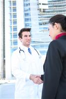 Doctor Handshake with Patient stock photo