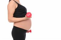 Pregnant Woman Working Out stock photo