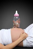 Pregnant Woman with Bottle Bank stock photo