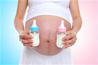 Pregnant Woman with Bottles stock photo