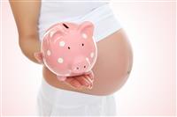 Pregnant Woman and Piggy Bank stock photo