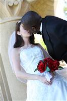 Interracial Wedding Couple Kissing stock photo
