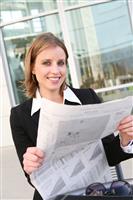 Pretty Business Woman with Newspaper stock photo