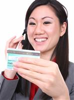 Asian Woman with Credit Card stock photo