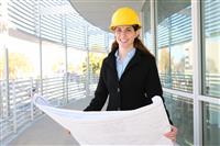 Woman Architect  with blueprints stock photo