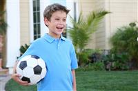 Young Boy with Soccer Ball stock photo