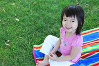 Cute Asian Girl on Grass stock photo