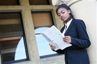 African Woman Reading Newspaper stock photo