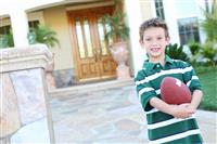 Young Boy at home with Football stock photo