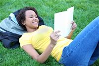 Pretty African American Reading stock photo