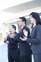 Hispanic Business Team Clapping stock photo