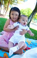 Cute Brother and Sister in Park stock photo