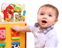 Cute Boy Playing with Toys stock photo