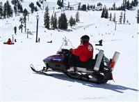 Rescuer on Snowmobile stock photo