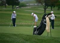 Golfers (Focus on Golf Bag) stock photo