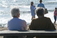 Elderly Couple on the Beach stock photo