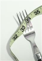 Fork and tape measure stock photo