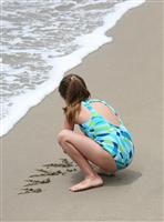 Girl on Beach stock photo