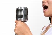 Singing (Focus on Microphone) stock photo