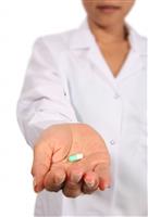 Nurse Giving Pill stock photo