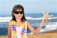 Girl Holding Starfish stock photo
