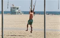 Teen Exercising on Beach stock photo