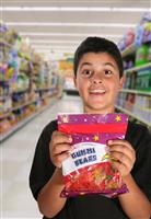 Boy Begging for Candy (Generic Candy Bag) stock photo