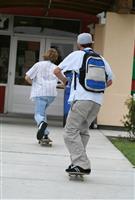 Skateboarding to School stock photo
