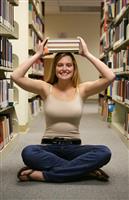 Girl in Library stock photo