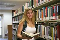 Young Woman in Library stock photo
