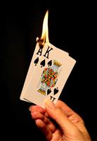 Hot Card Hand (Focus at bottom of flame) stock photo