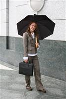 Woman Carrying Umbrella stock photo
