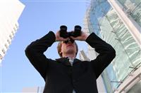 Business Man with Binoculars stock photo
