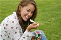 Pretty Woman Eating Yogurt stock photo