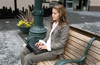 Woman Using Laptop stock photo