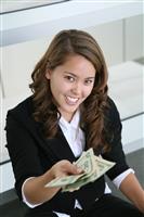 Business Woman Giving Money stock photo
