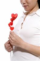 Woman With Heart Lollipop stock photo