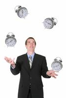 Business Man Juggling His Time stock photo
