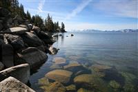 Rock, Lake, and Mountain Landscape  stock photo