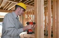 Construction Man Using Drill stock photo