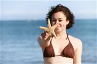 Woman Holding Starfish stock photo