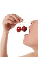 Woman Eating Cherries stock photo